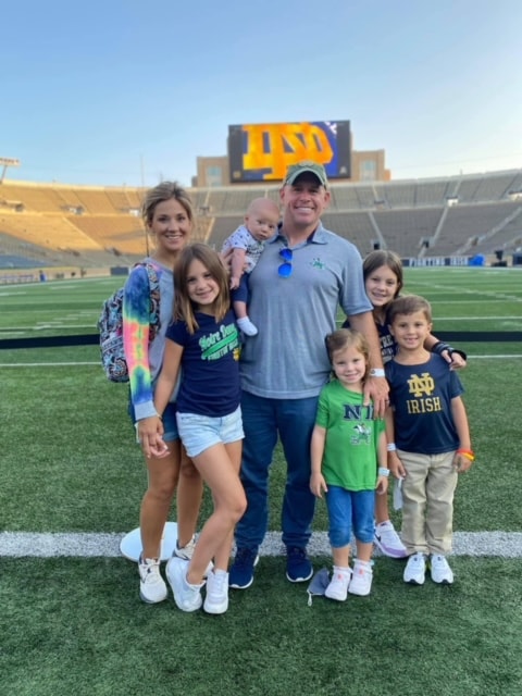 Timmy O'Neill with his family on the Notre Dame field